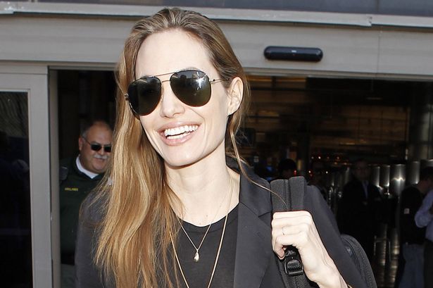 Angelina proudly sported a wedding band at a recent UN event in Congo. Image: Maciel/X17online.com