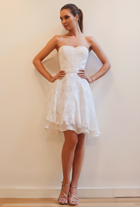 Having a beach wedding? This short 'n simple strapless white dress from Francesca Miranda is replete with beautiful and very subtle details that take it beyond a little white dress and truly make it fit for your wedding day. 