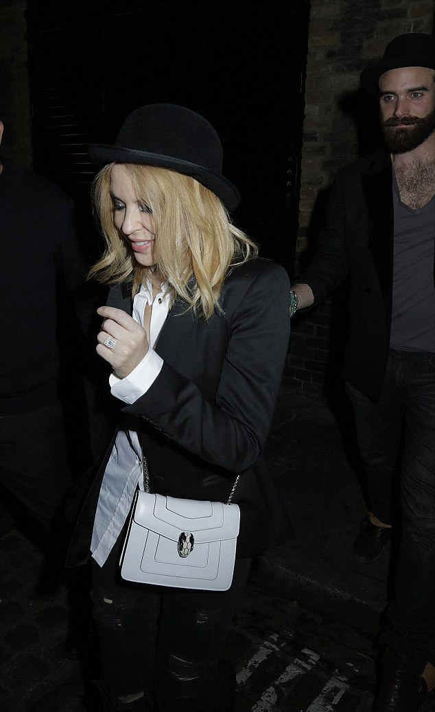 Kylie Minogue was photographed leaving a restaurant with Joshua sporting a grin and a HUGE sparkler on her wedding finger. Image: blitz pictures/timmclees/jamescurley via Daily Mail 