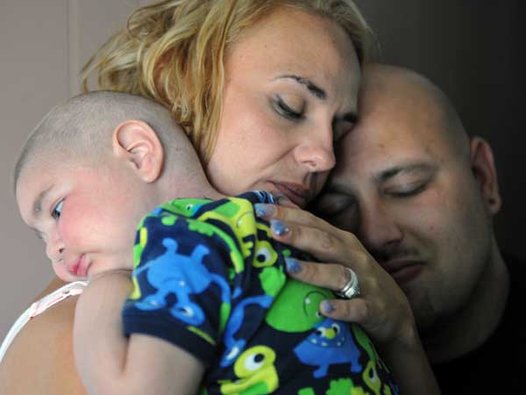In one of their final photos together, Christine Swidorsky and Sean Stevenson  hold their sleeping son. Image:  AP Photo/Tribune-Review, Eric Schmadel