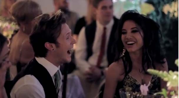 One of Tom's bandmates (and a groomsman) reacts to a line in his medely thanking them