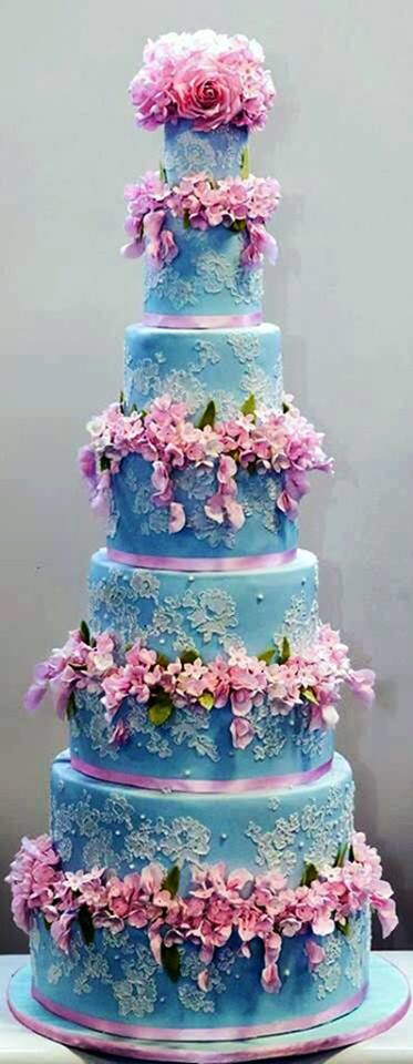 blue wedding cake with pink blooms