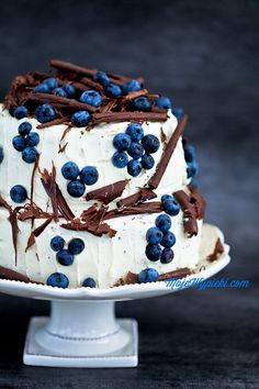 wedding cake with blueberries on top