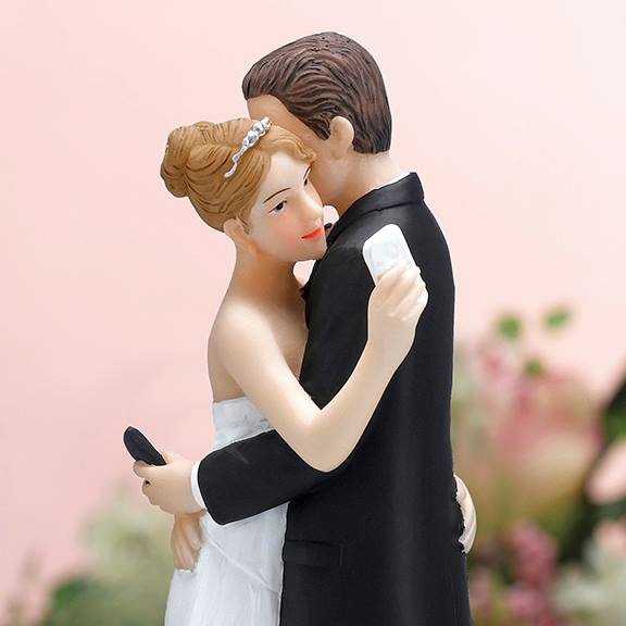 bride-and-groom-hugging-while-on-phone