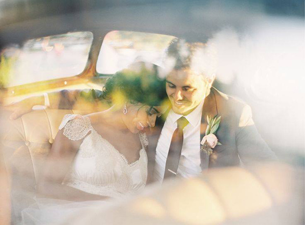 bride and groom having a special moment in the car