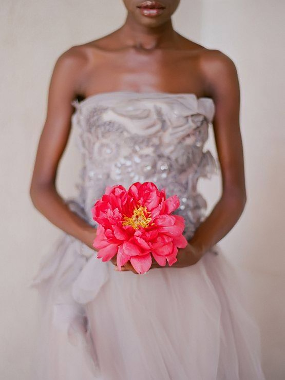 bride holding a giant flower