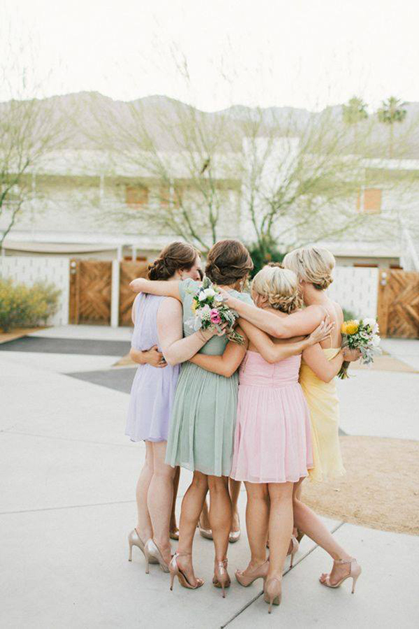 bridesmiads hugging with the bride