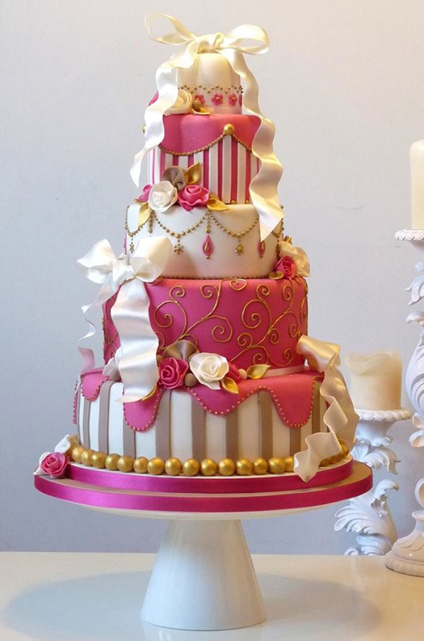 wedding cake in champagne and bright pink colors