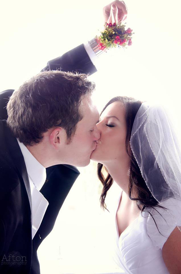 misltetoe over wedding kiss